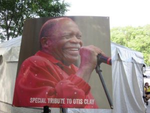 Poster of Otis Clay next to stagesm